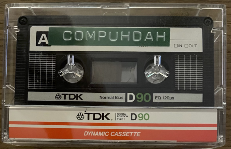 photograph of a cassette tape titled Compudah